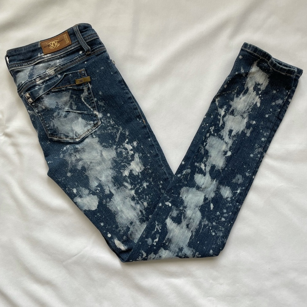 Jeans with studs and bleach splattering
